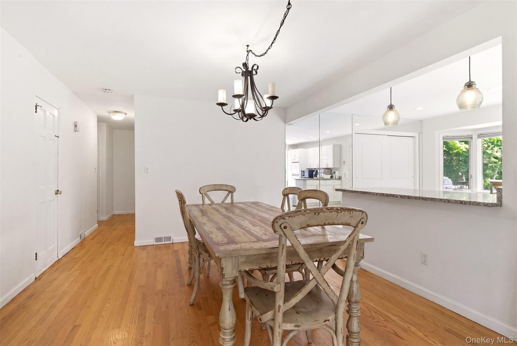 106 Vineyard Road Huntington, NY 11743 - Photo 16 of 25 a view of a dining room with furniture window and wooden floor