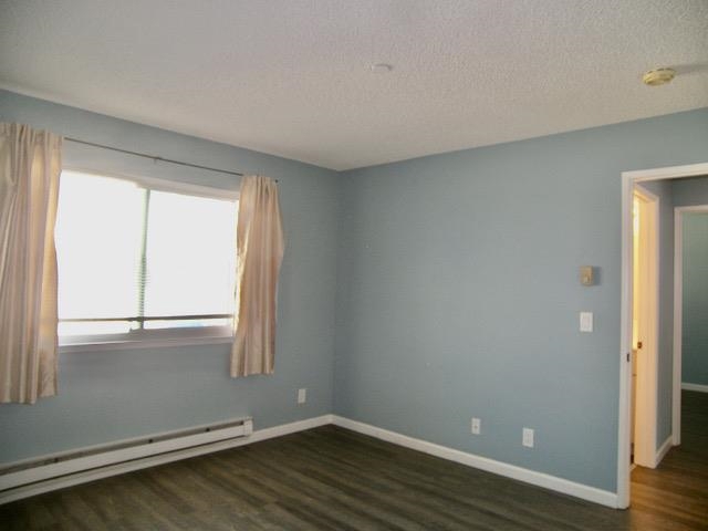 39470 Albany Common Fremont, CA 94538 - Photo 9 of 13 an empty room with wooden floor and windows