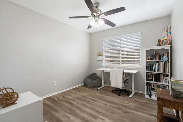 a room that has a bed and a chair in it