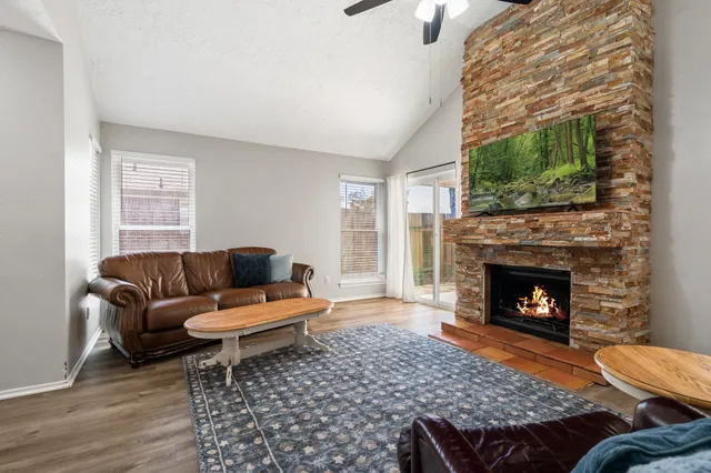 a living room with furniture and a fireplace