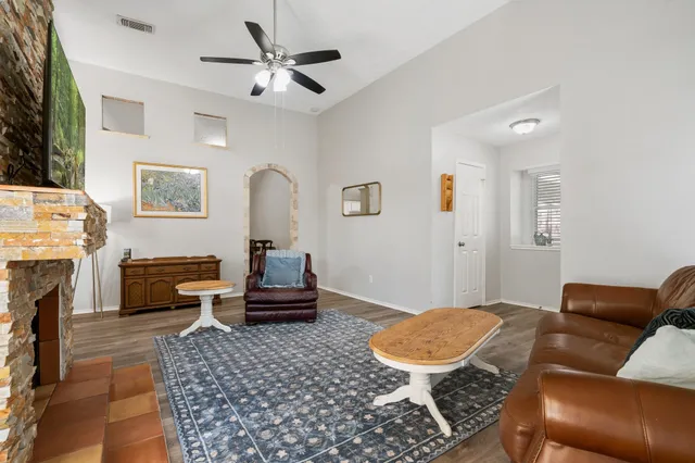 a living room with furniture and a fireplace