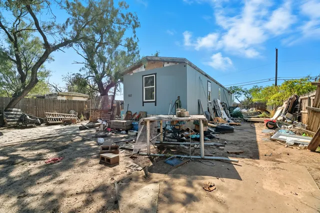 a view of a back yard of the house