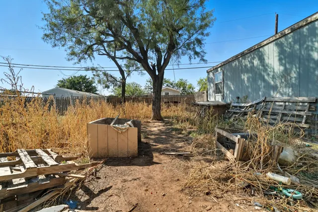 a view of a lake with table and chairs