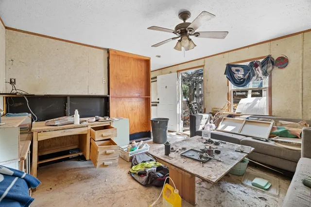 a work room with furniture and a window