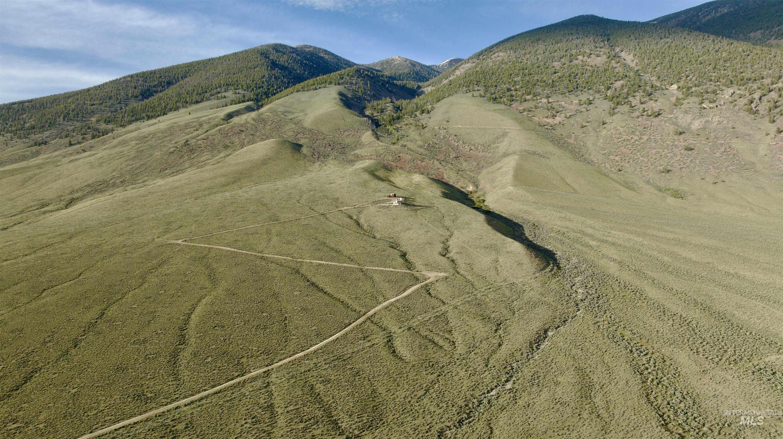 2040 Pahsimeroi River Road May, ID 83253 - Photo 28 of 29 Expansive mountain landscape featuring a small structure nestled into the hillside