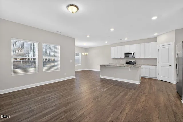 a view of swimming pool with wooden fence