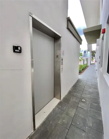 a large white building with a white roof