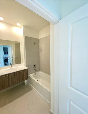 a view of a hallway with seating area