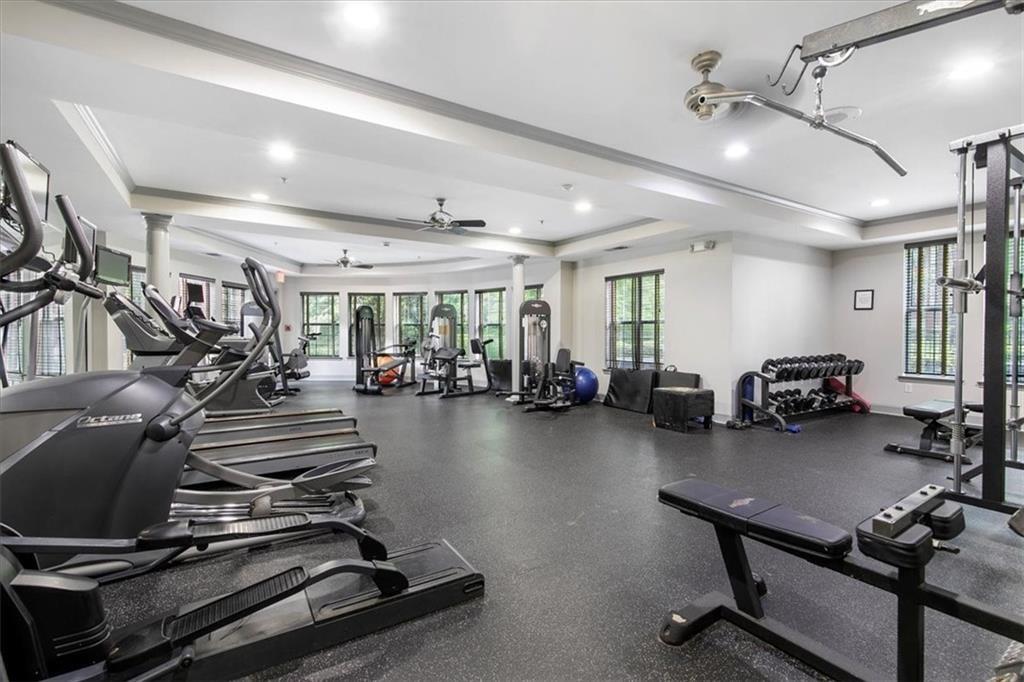 4102 Westchester Ridge Northeast Brookhaven, GA 30329 - Photo 20 of 35 a gym room with lots of chairs and mirrors