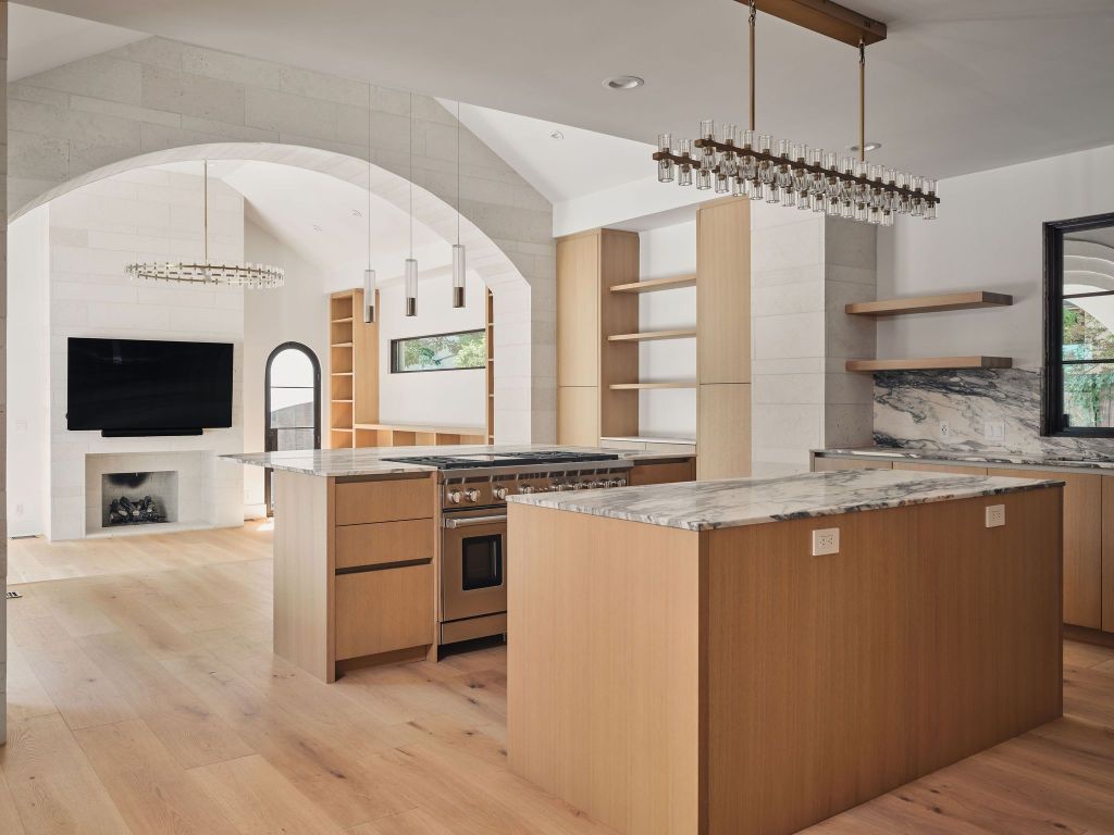 13 Niles Road Austin, TX 78703 - Photo 13 of 40 a large kitchen with stainless steel appliances granite countertop a stove and a sink