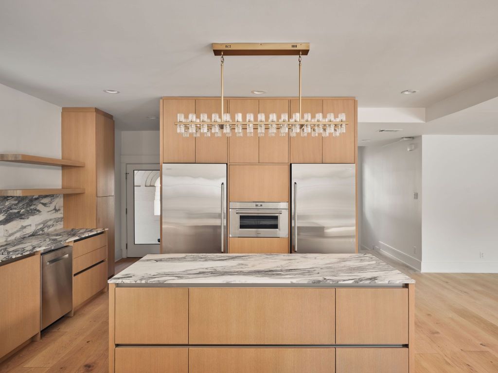 13 Niles Road Austin, TX 78703 - Photo 15 of 40 a kitchen with kitchen island a stove a sink and a refrigerator