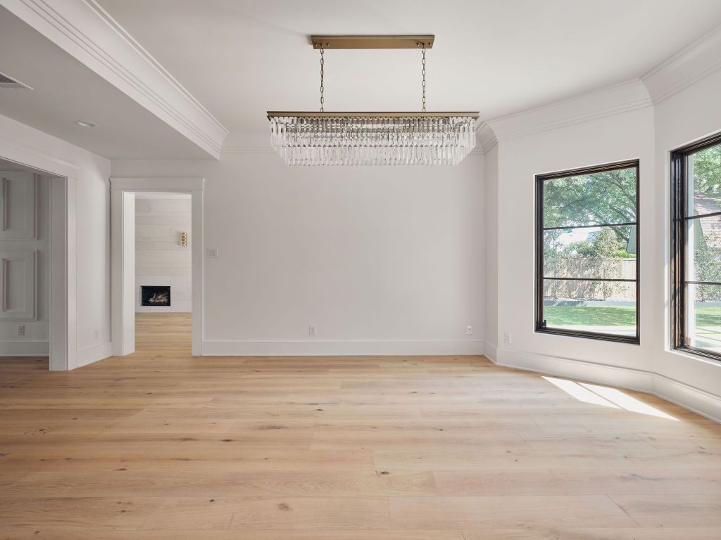 13 Niles Road Austin, TX 78703 - Photo 16 of 40 a view of an empty room with wooden floor and a window