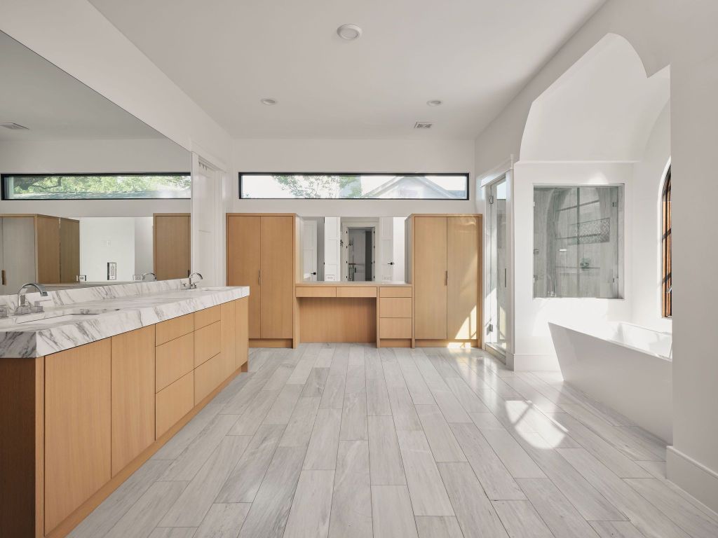 13 Niles Road Austin, TX 78703 - Photo 28 of 40 a large white room with a large window and wooden floor