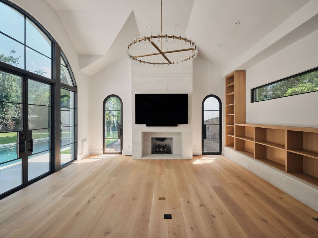 13 Niles Road Austin, TX 78703 - Photo 3 of 40 a view of livingroom with furniture flat screen tv and floor to ceiling window