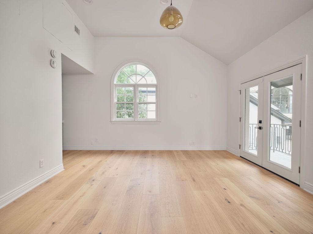 13 Niles Road Austin, TX 78703 - Photo 35 of 40 an empty room with wooden floor and windows