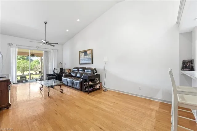 a living room with furniture window and a table