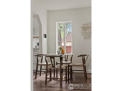 a view of a dining room with furniture and window