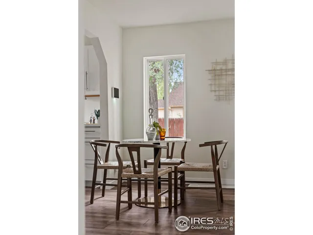 a view of a dining room with furniture and window