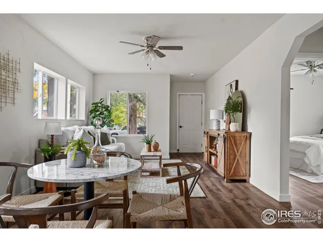 a view of a dining room with furniture and wooden floor