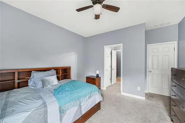 a bedroom with bed and window