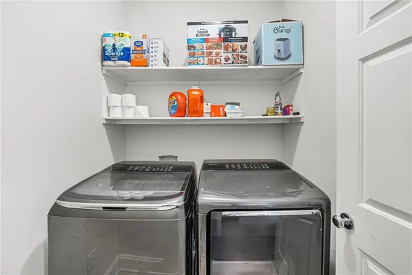 a utility room with dryer and washer