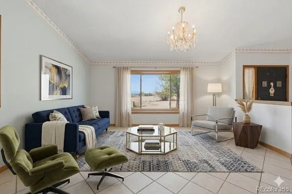 a living room with furniture and a chandelier