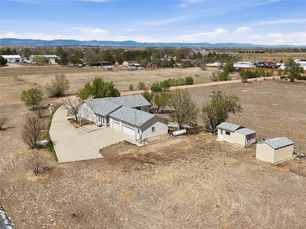 an aerial view of a house with a lake view