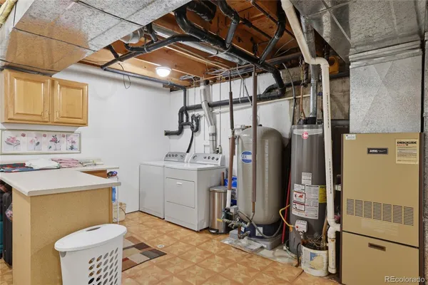 a view of a storage & utility room with a washer and dryer