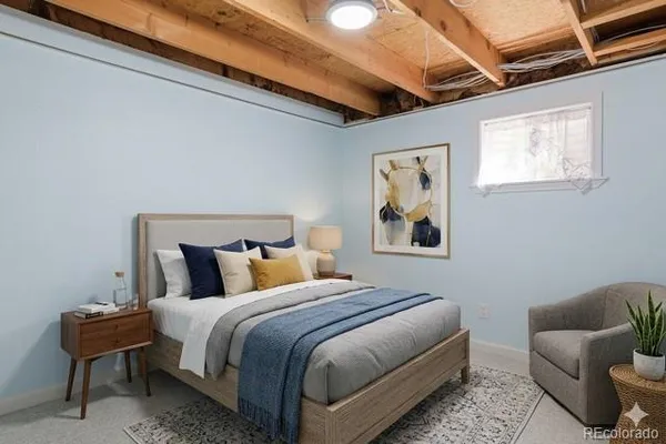 a bedroom with bed and wooden floor