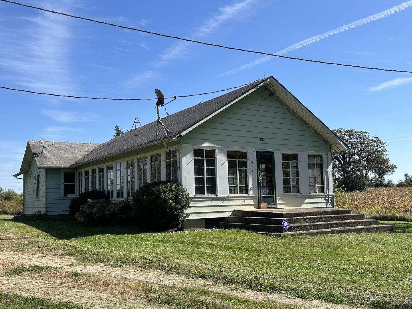 16104 McGuire Road Harvard, IL 60033 - Photo 11 of 17 a front view of a house with yard