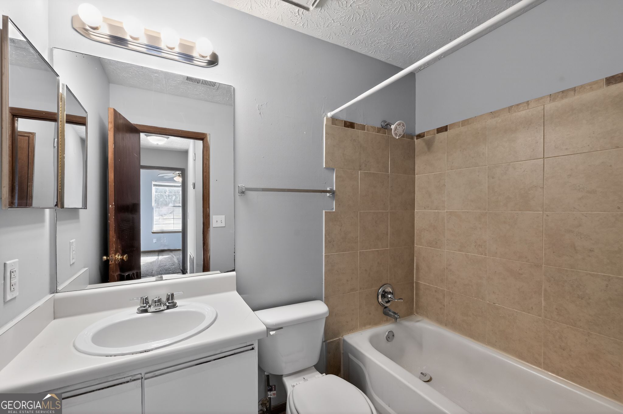 10248 Briarbay Loop Jonesboro, GA 30238 - Photo 22 of 31 a bathroom with a sink toilet and shower