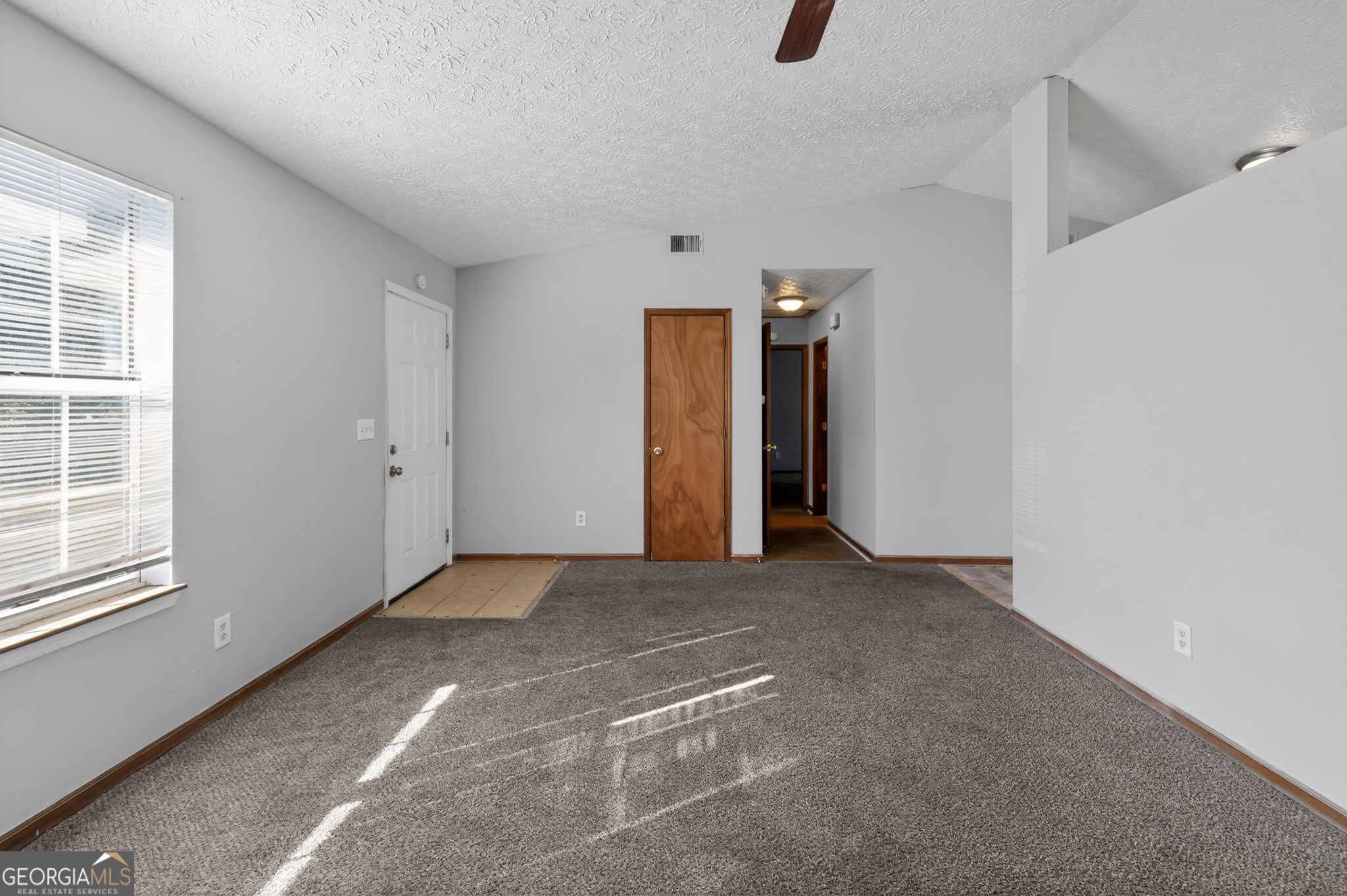 10248 Briarbay Loop Jonesboro, GA 30238 - Photo 10 of 31 an empty room with windows