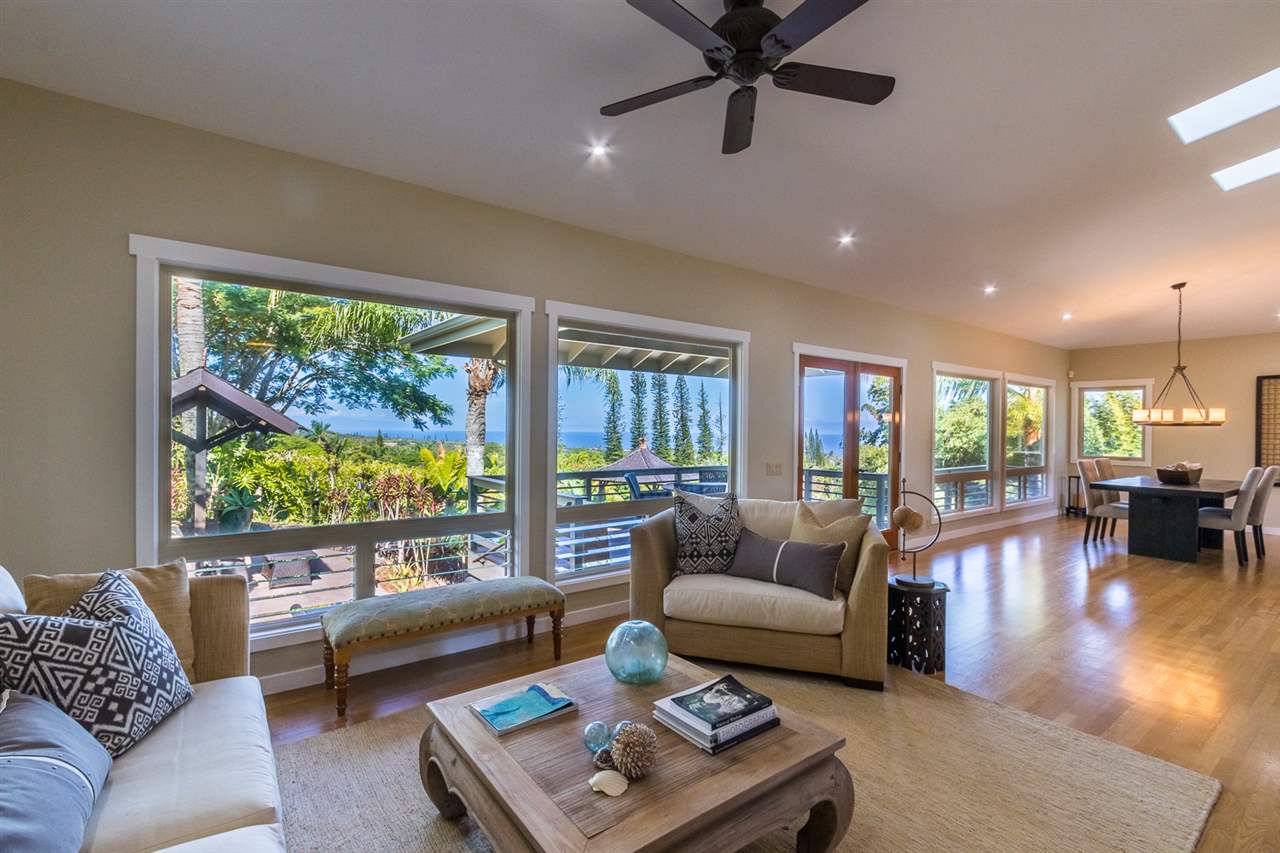 195 Mauu Place Haiku, HI 96708 - Photo 11 of 30 a living room with furniture and a large window
