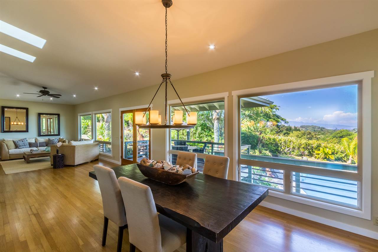 195 Mauu Place Haiku, HI 96708 - Photo 13 of 30 a view of a dining room with furniture large windows and wooden floor