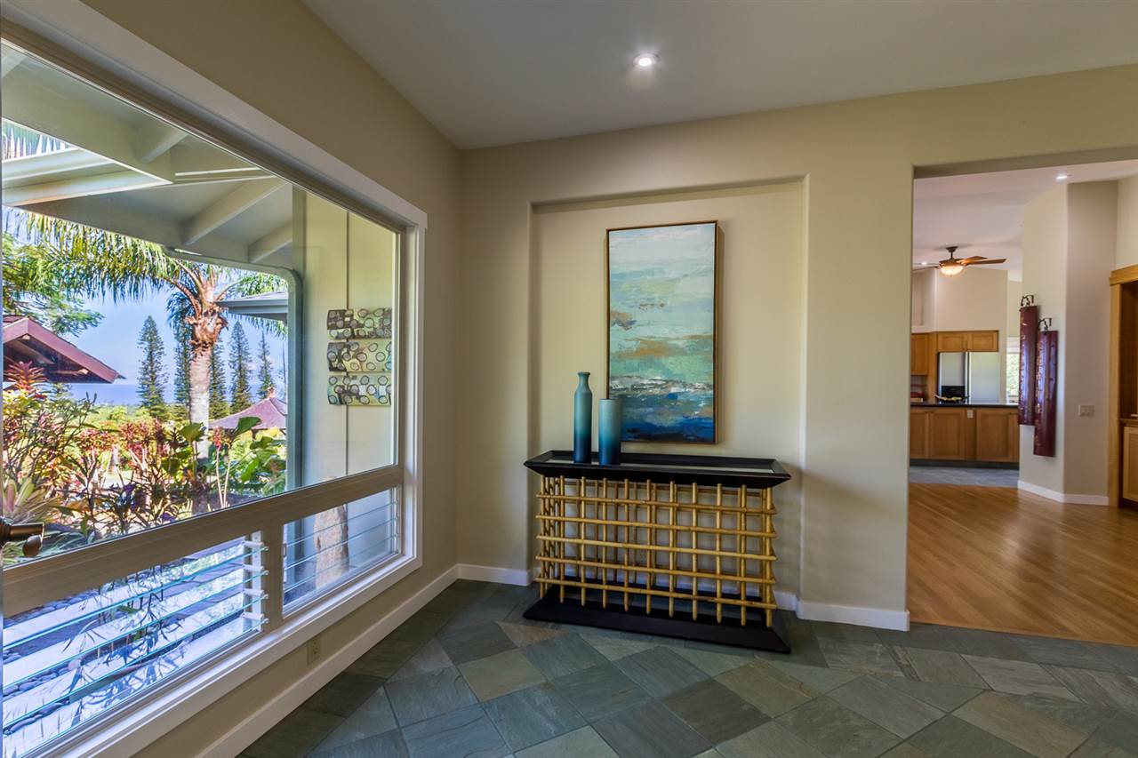 195 Mauu Place Haiku, HI 96708 - Photo 8 of 30 a view of a room with wooden floor and a floor to ceiling window