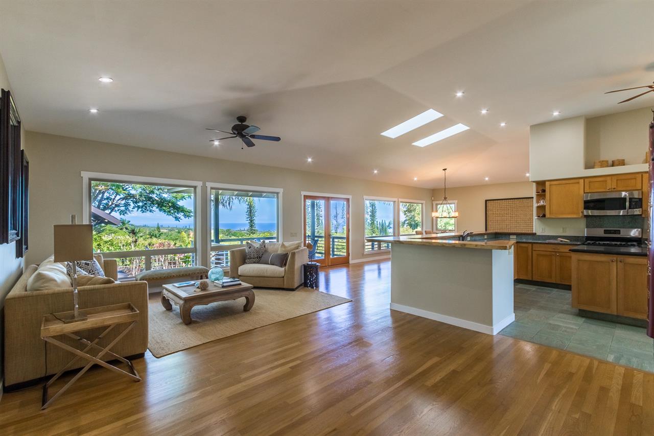 195 Mauu Place Haiku, HI 96708 - Photo 10 of 30 a living room kitchen with furniture and a large window