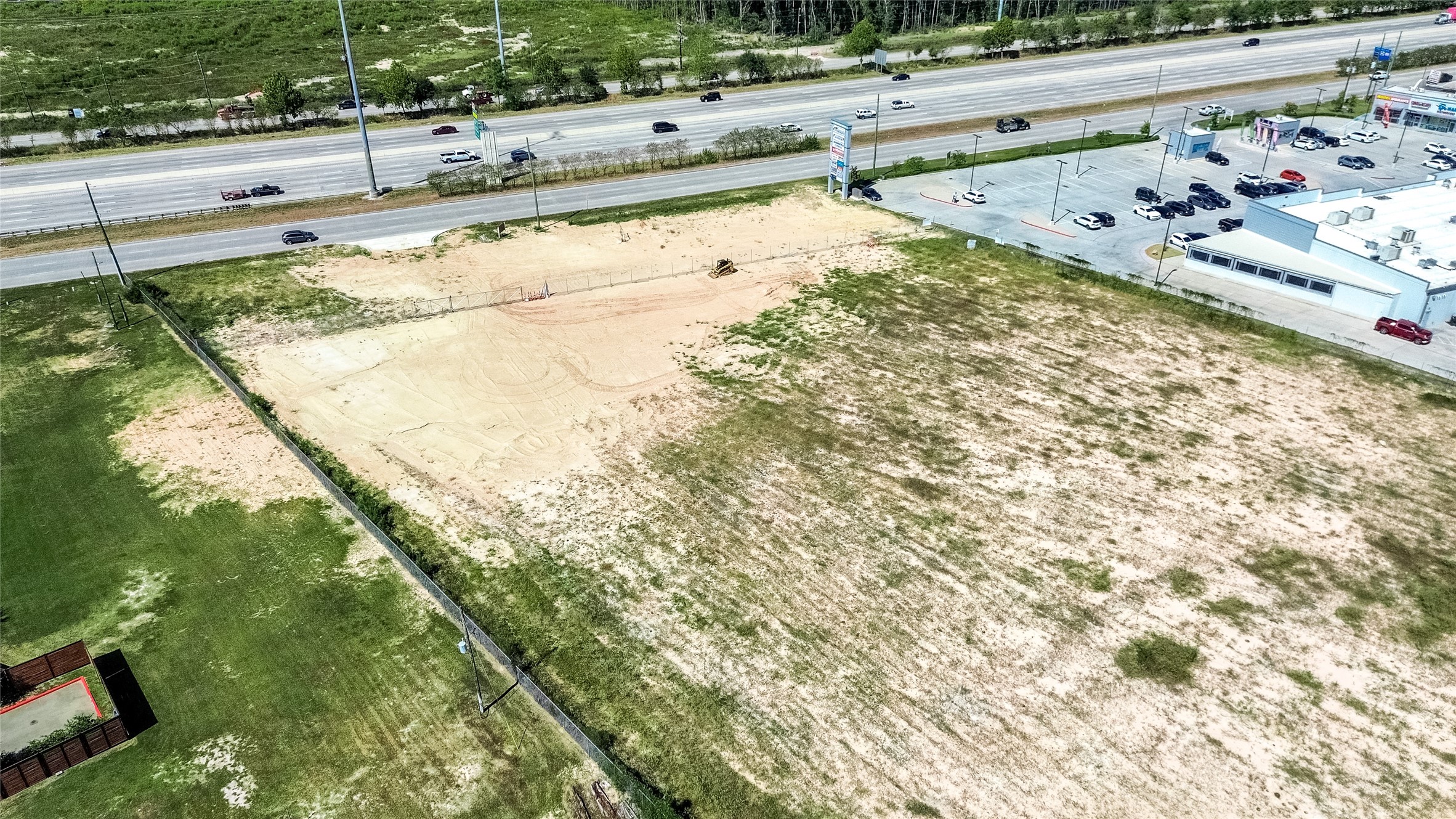24255 Us Highway Porter, TX 77365 - Photo 15 of 24 a view of a swimming pool with a yard