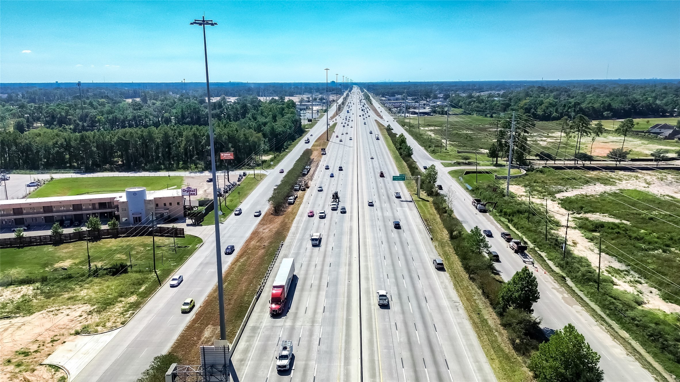 24255 Us Highway Porter, TX 77365 - Photo 23 of 24 a view of a swimming pool with a lounge chairs