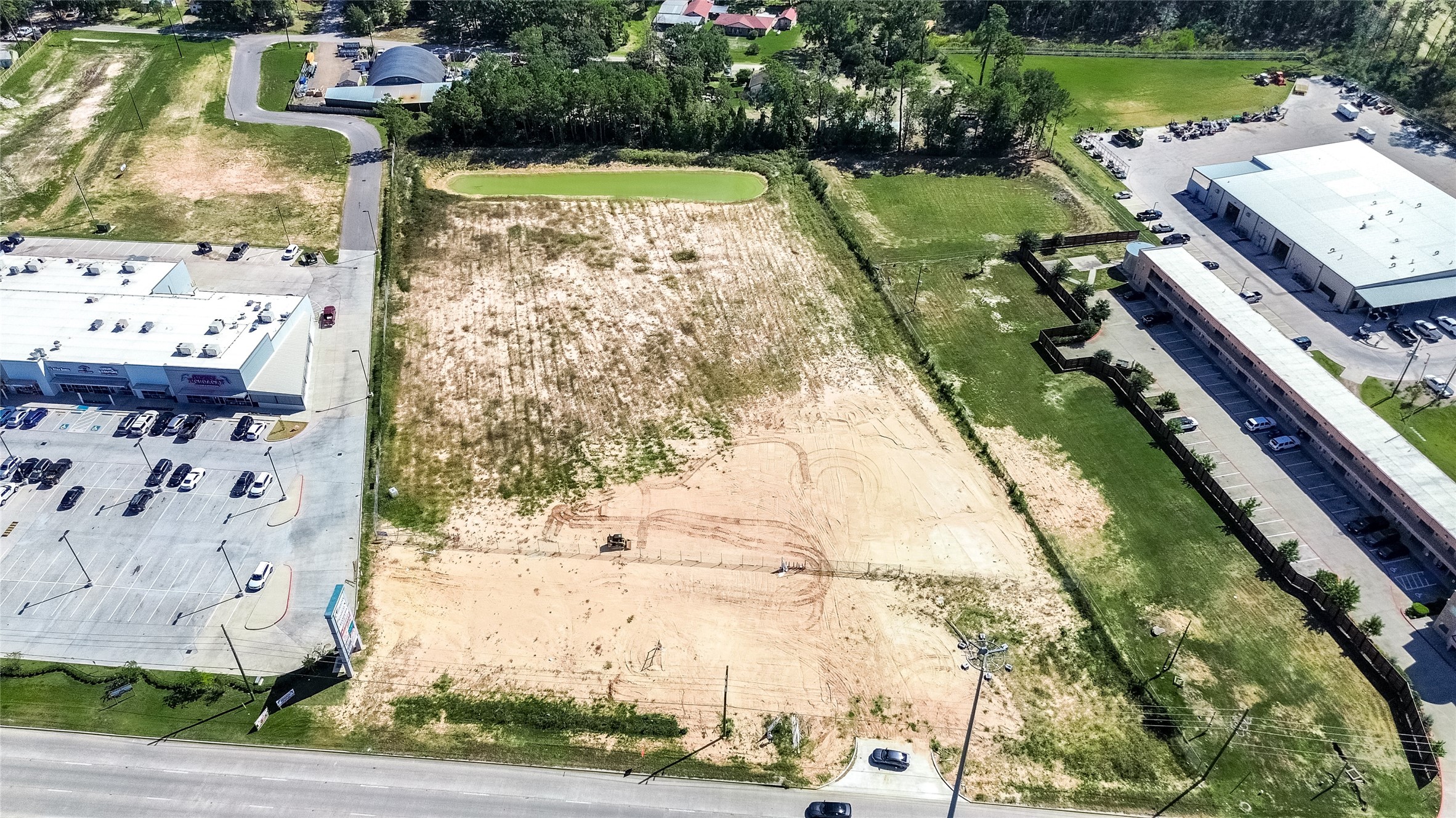 24255 Us Highway Porter, TX 77365 - Photo 6 of 24 a view of a lake with a big yard