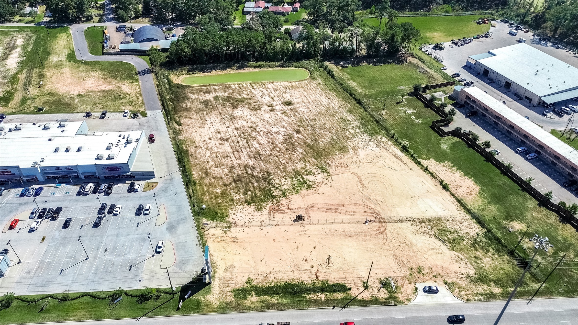 24255 Us Highway Porter, TX 77365 - Photo 7 of 24 a view of a lake with outdoor space