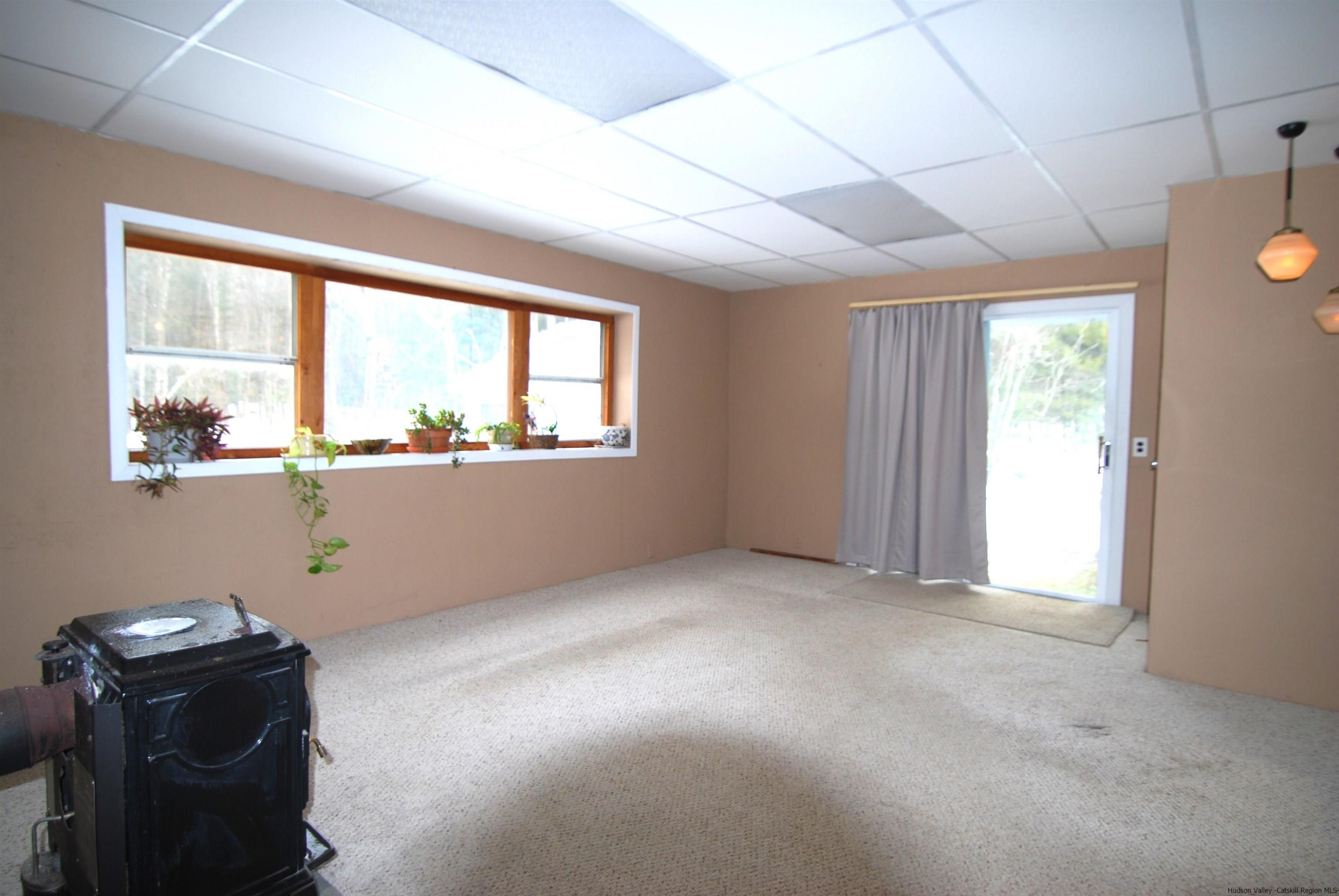 437 Scarawan Road Stone Ridge, NY 12484 - Photo 20 of 35 a view of an empty room with a window