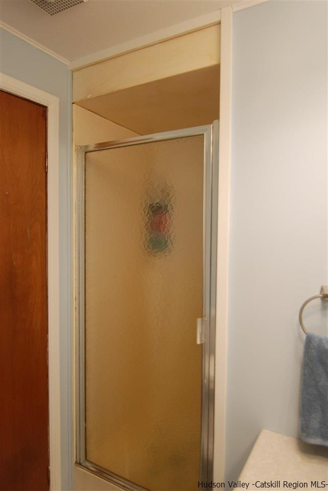 437 Scarawan Road Stone Ridge, NY 12484 - Photo 26 of 35 a bathroom with a toilet and a shower