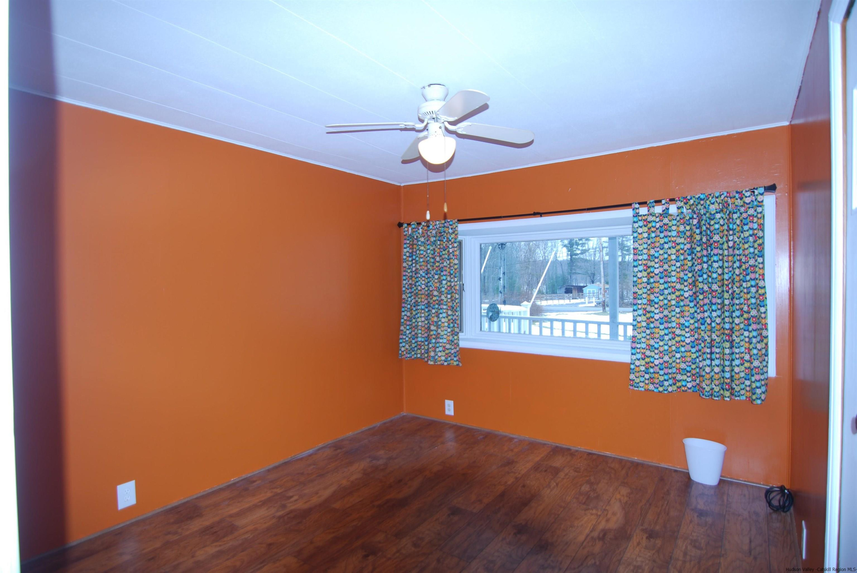 437 Scarawan Road Stone Ridge, NY 12484 - Photo 28 of 35 a view of a room with a ceiling fan and a window