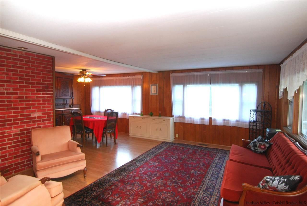 437 Scarawan Road Stone Ridge, NY 12484 - Photo 5 of 35 a living room with furniture and a large window