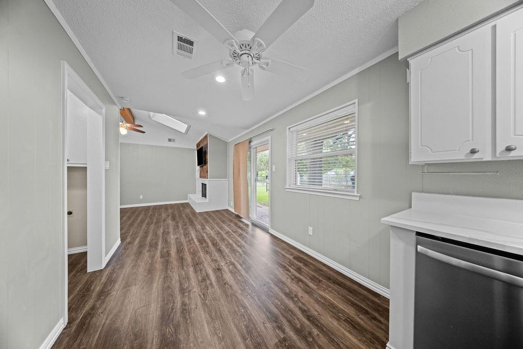 1041 Barber Street Hurst, TX 76053 - Photo 15 of 36 a view of an empty room with window and wooden floor