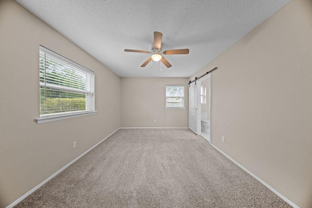 1041 Barber Street Hurst, TX 76053 - Photo 18 of 36 a view of an empty room with a window