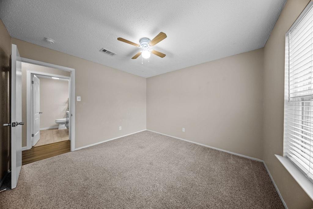 1041 Barber Street Hurst, TX 76053 - Photo 24 of 36 wooden floor in an empty room with a window
