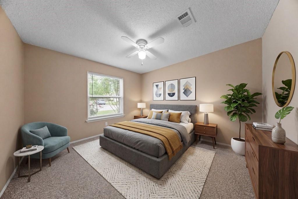 1041 Barber Street Hurst, TX 76053 - Photo 26 of 36 a bedroom with a large bed and a window