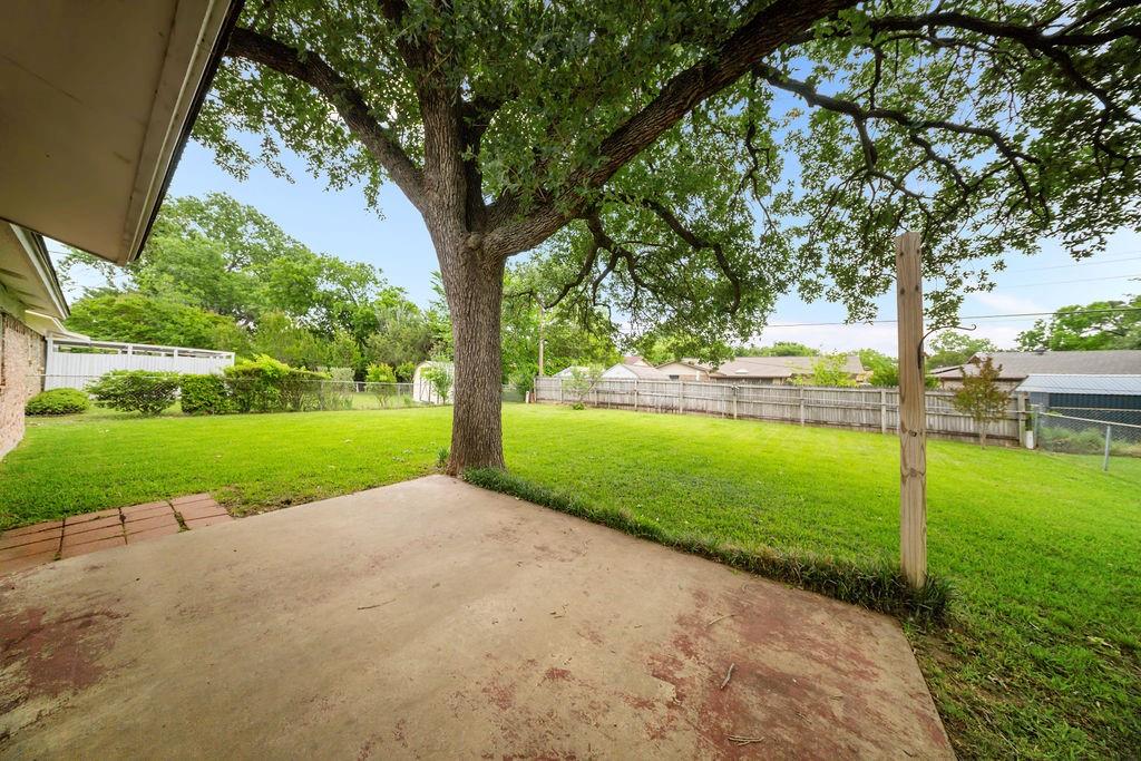 1041 Barber Street Hurst, TX 76053 - Photo 29 of 36 a view of grassy field with trees