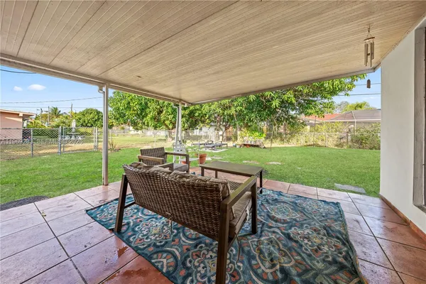 a view of a couches in backyard of the house